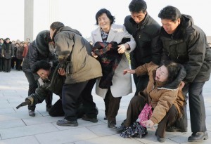 Pyongyang residents react as they mourn the death of North Korean leader Kim Jong-il in Pyongyang